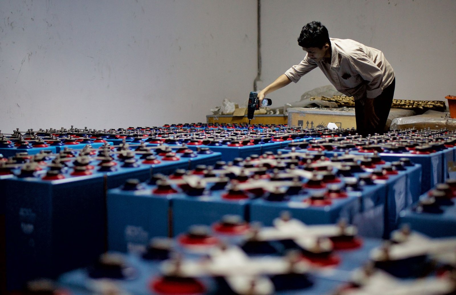 Rows of rack batteries being inspected